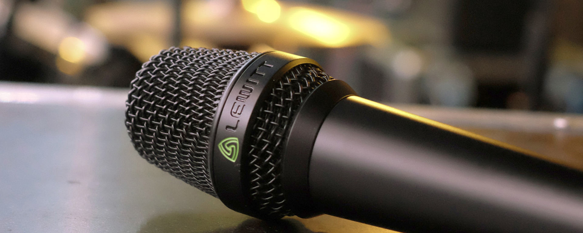 This image shows the MTP 840 DM live performance microphone on stage